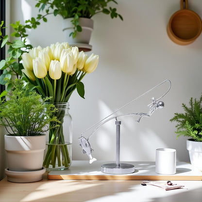 balanced fisherman sculpture