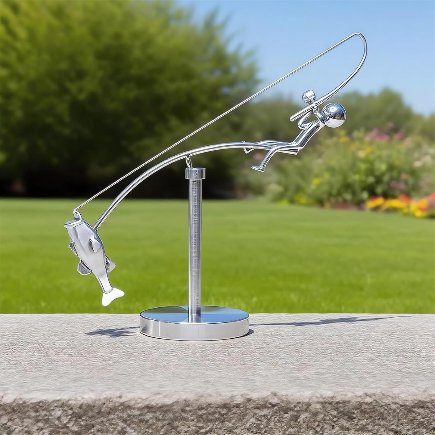 balanced fisherman sculpture