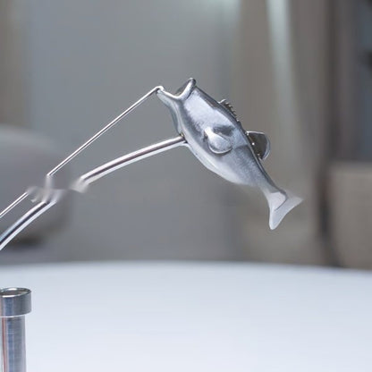 balanced fisherman sculpture